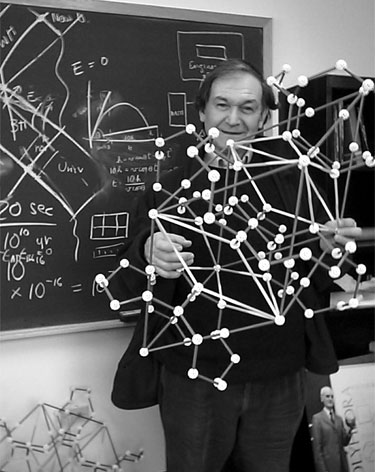 Roger Penrose holding a quasicrystalline structure